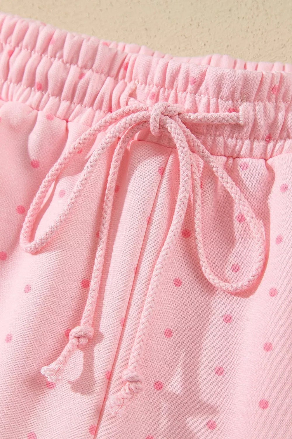 Pink polka dot oversized hoodie and shorts set — design and construction details