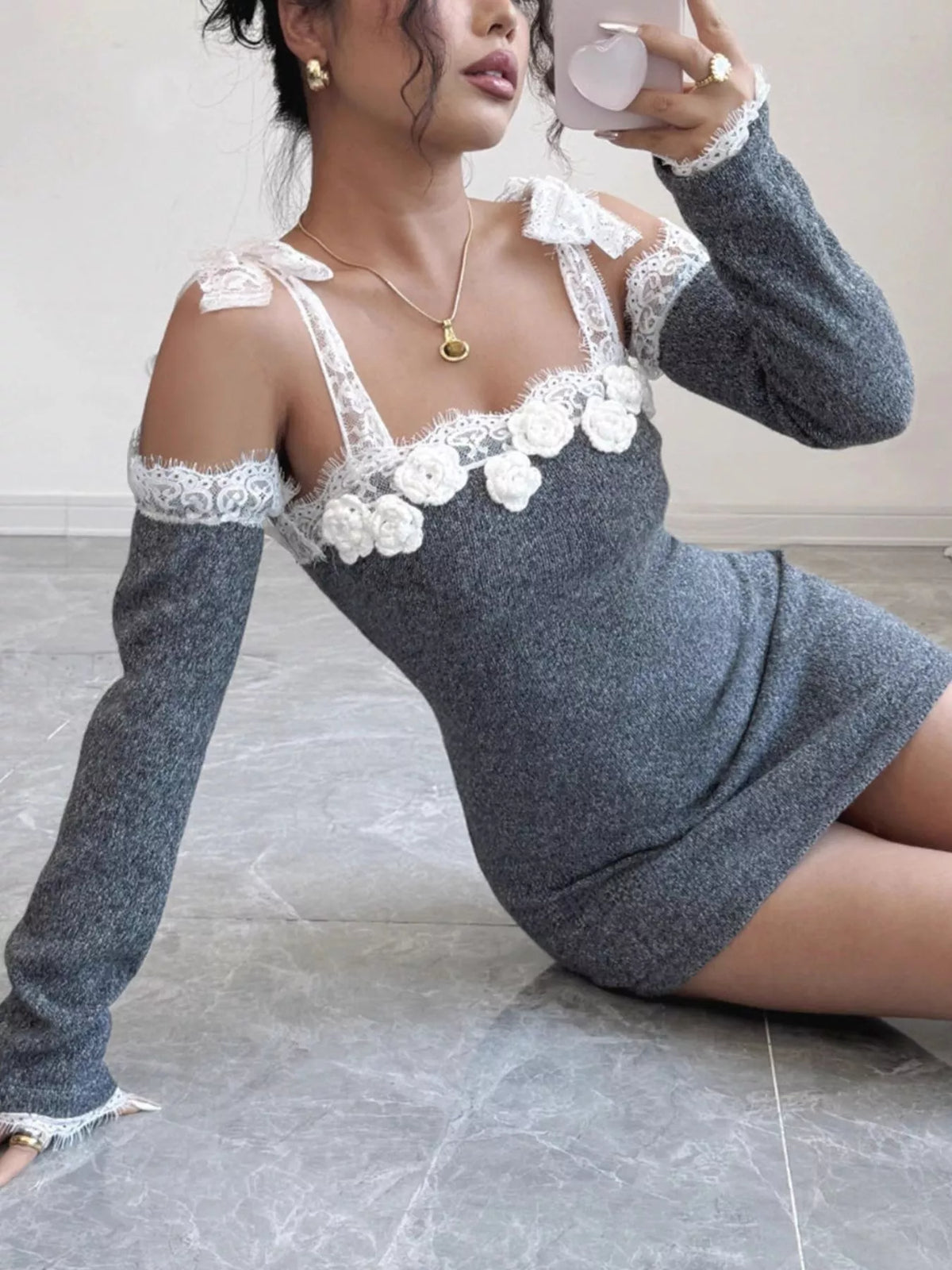Gray lace-trim cold-shoulder knit mini dress, seated side view