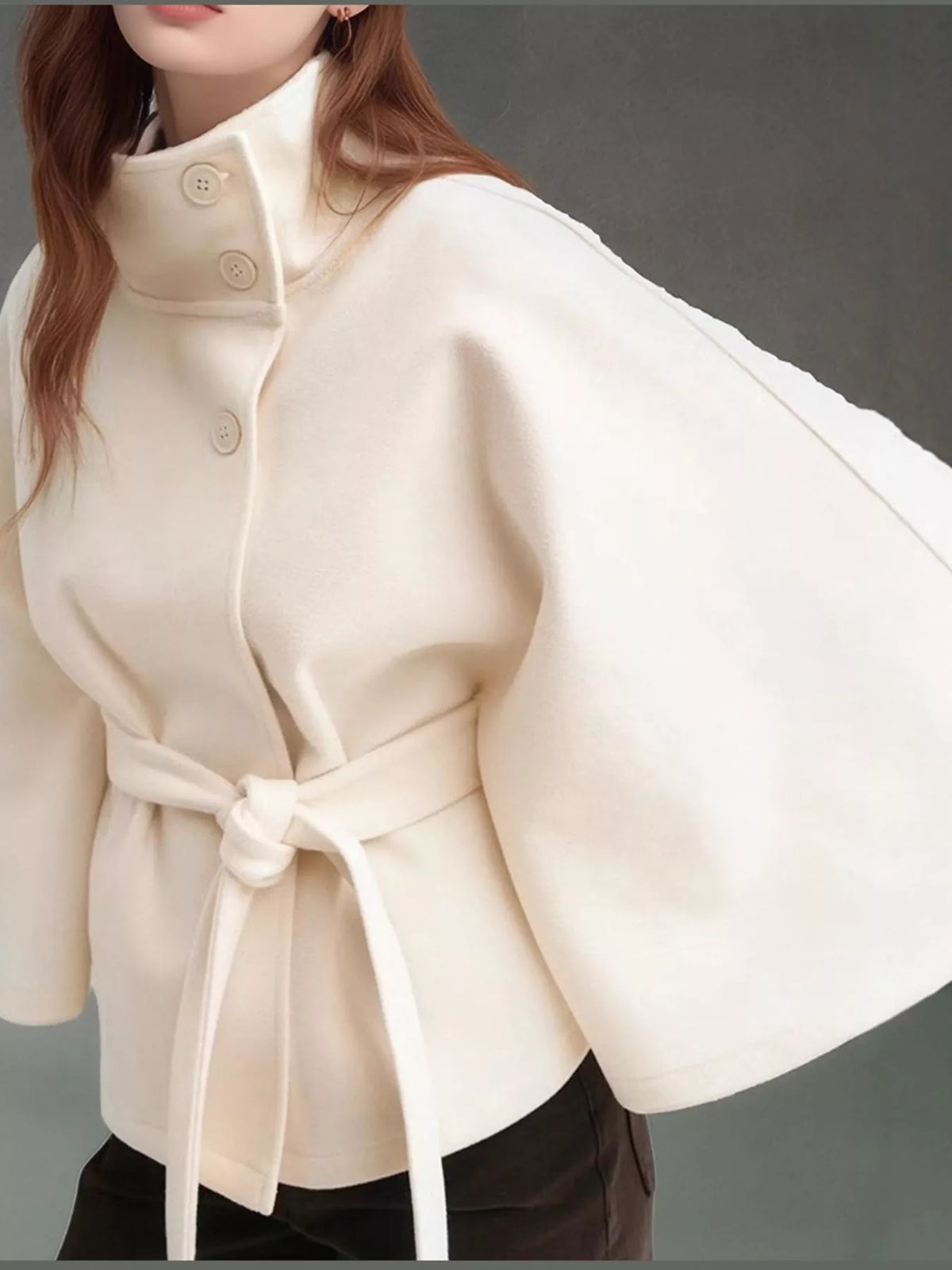 White belted button-front cape — front view