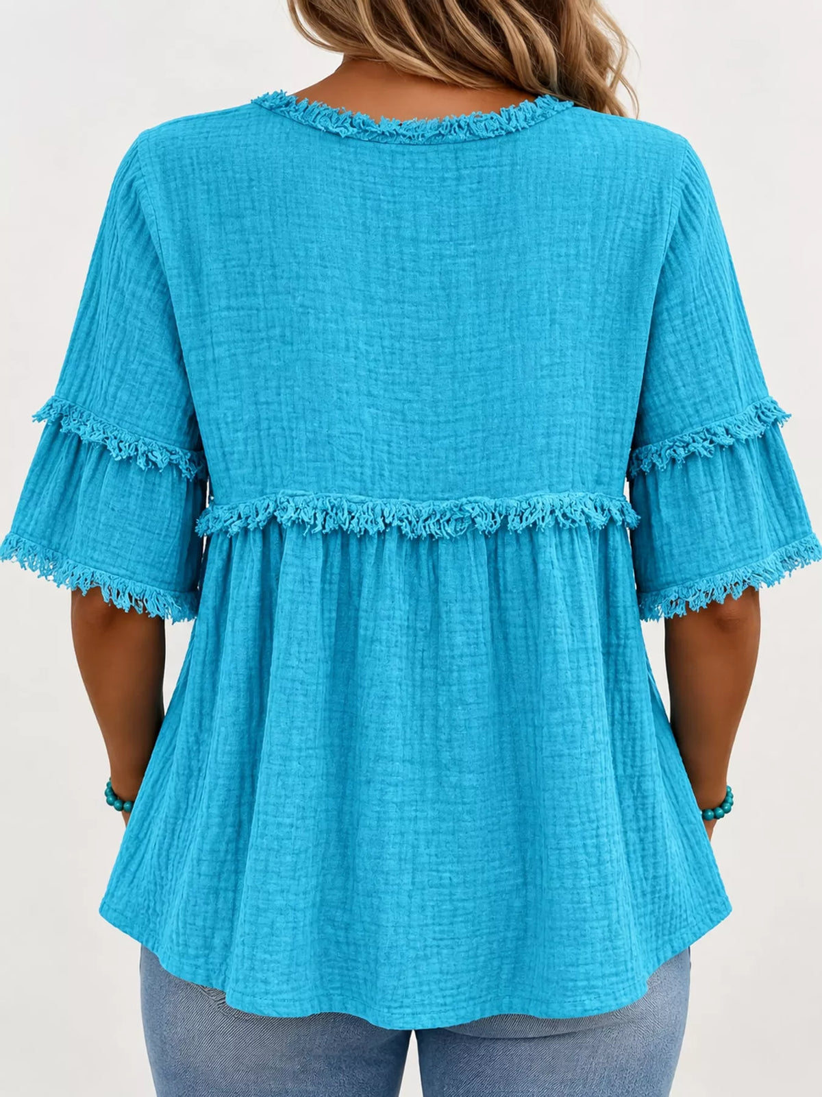 Turquoise frayed edge textured blouse, back view