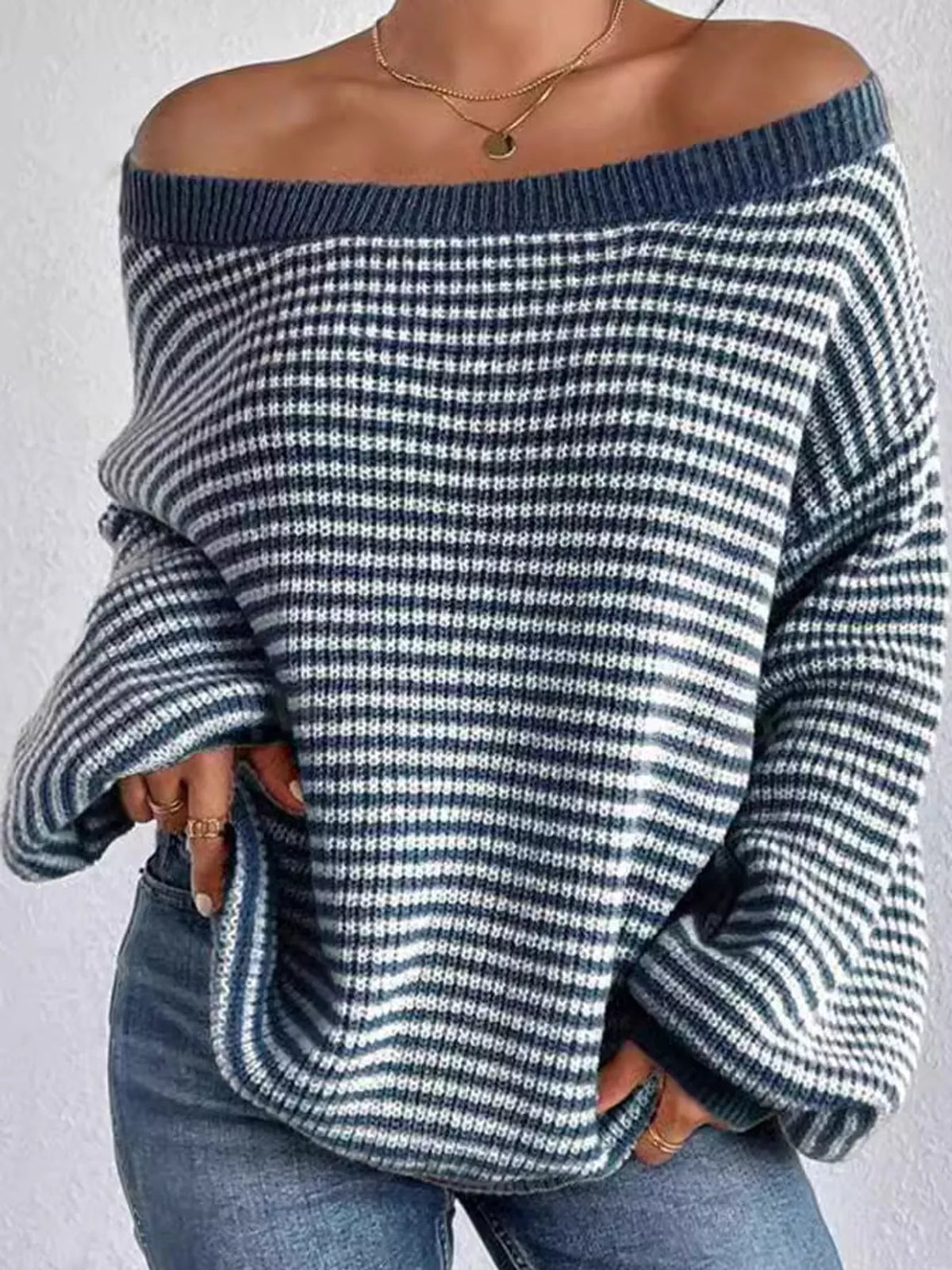 Blue and white striped knit boat neck sweater