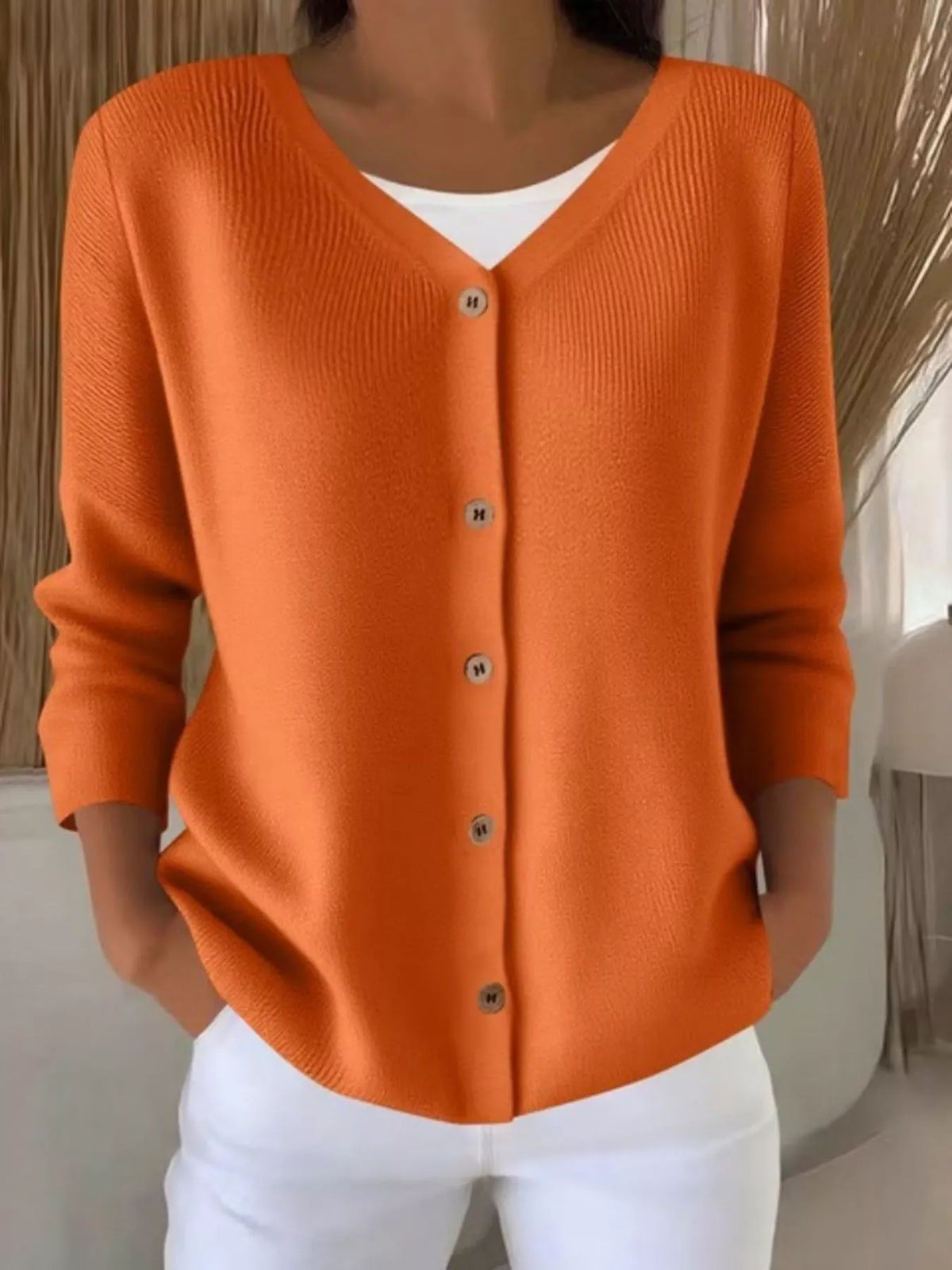 Orange ribbed button-front cardigan, front view