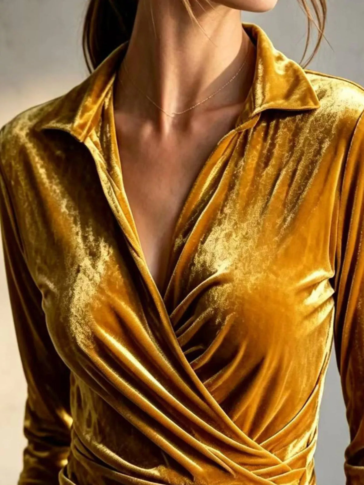 Gold velvet wrap-front ruched blouse, wrap neckline detail.