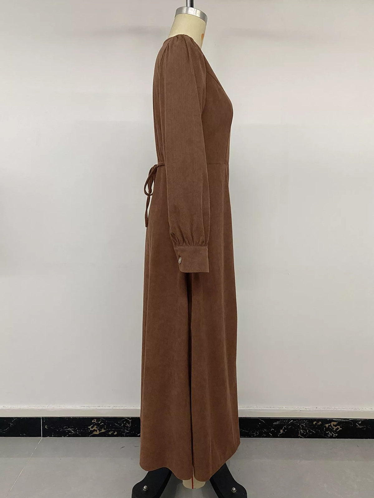Brown corduroy button-down maxi dress, side on mannequin