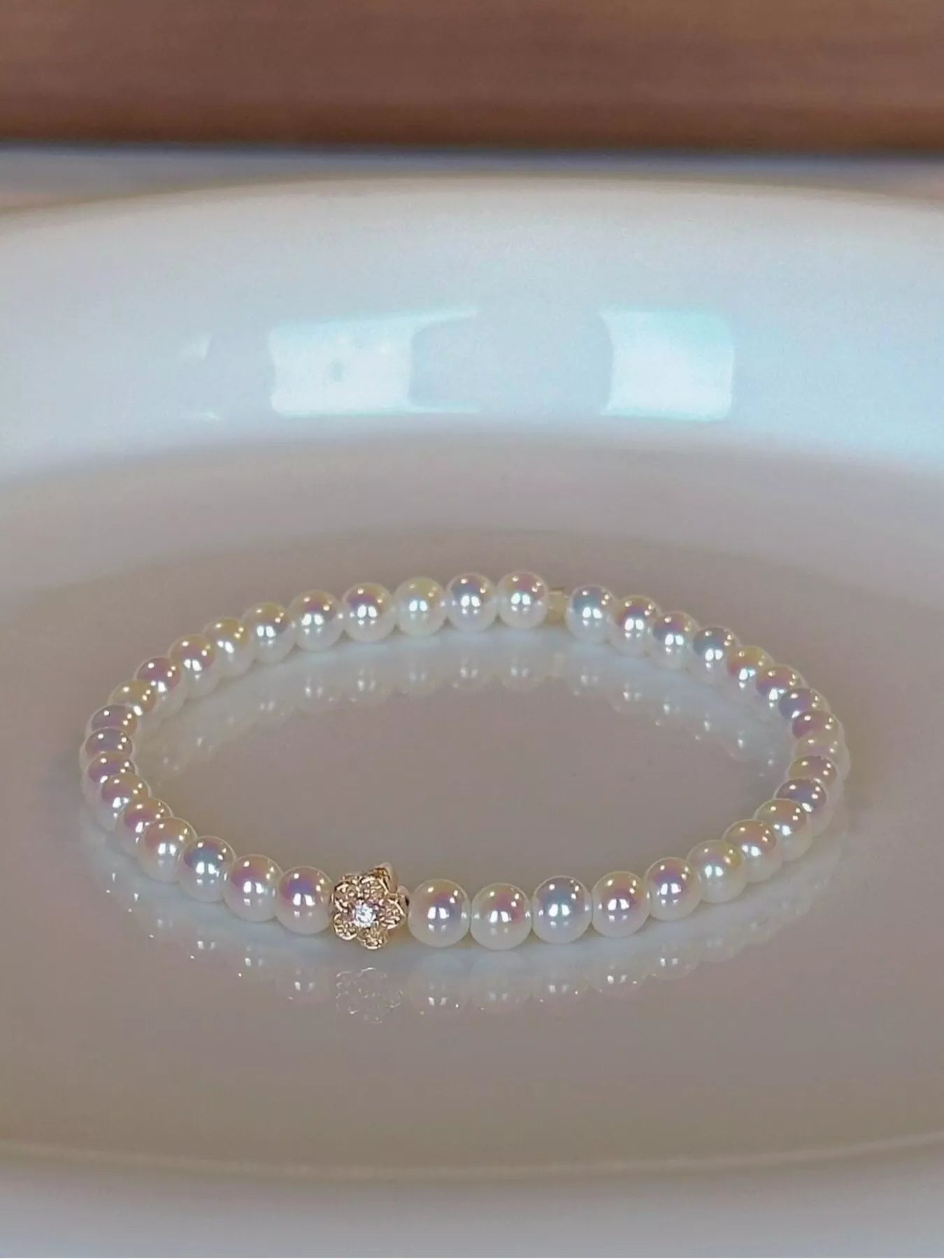 Trendsi Pearl Bracelet with Floral Accent -
