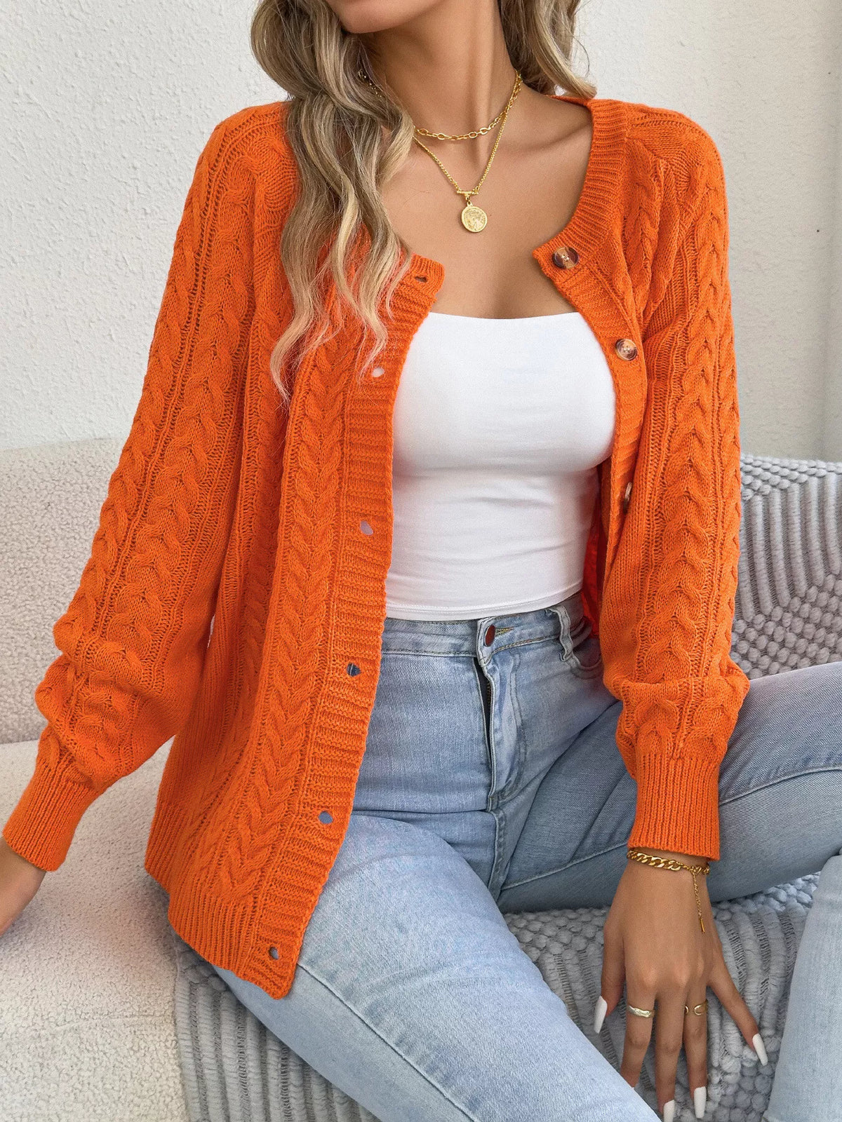 Orange cable knit button-front cardigan