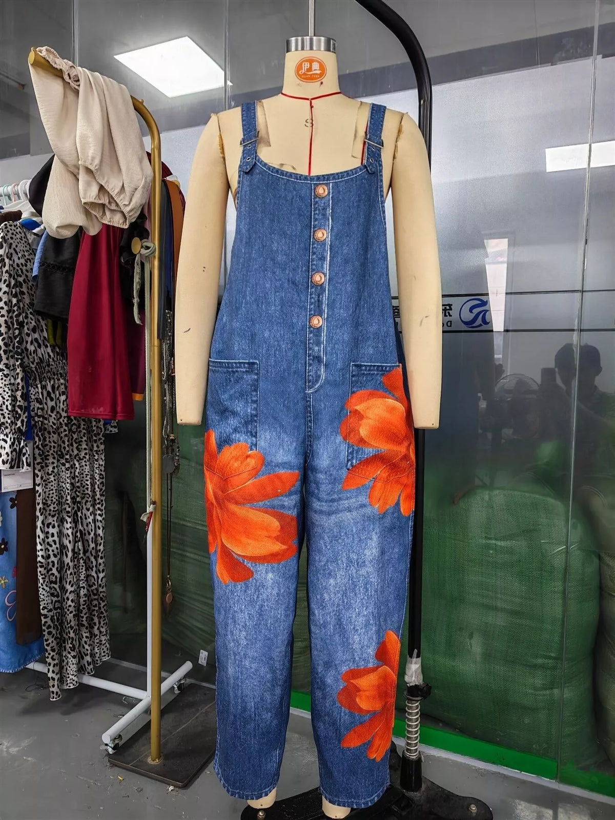 Blue and orange floral floral print button front overalls — front view