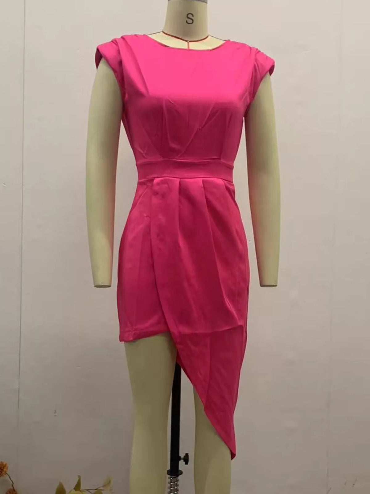 Women's Asymmetrical Backless Pleated Dress in pink — mannequin front view