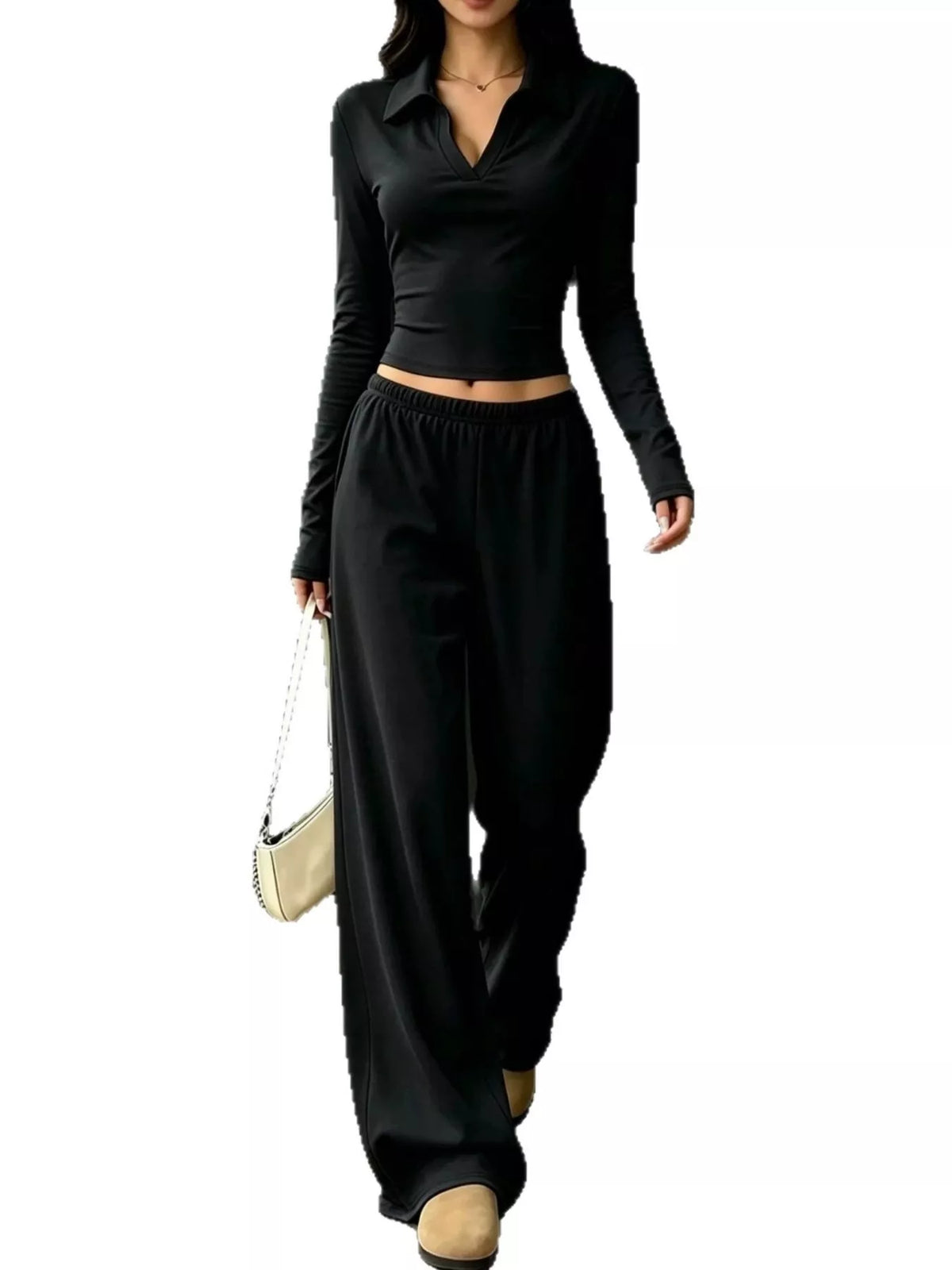 Black collared crop top and wide-leg pants set, front view with one leg bent