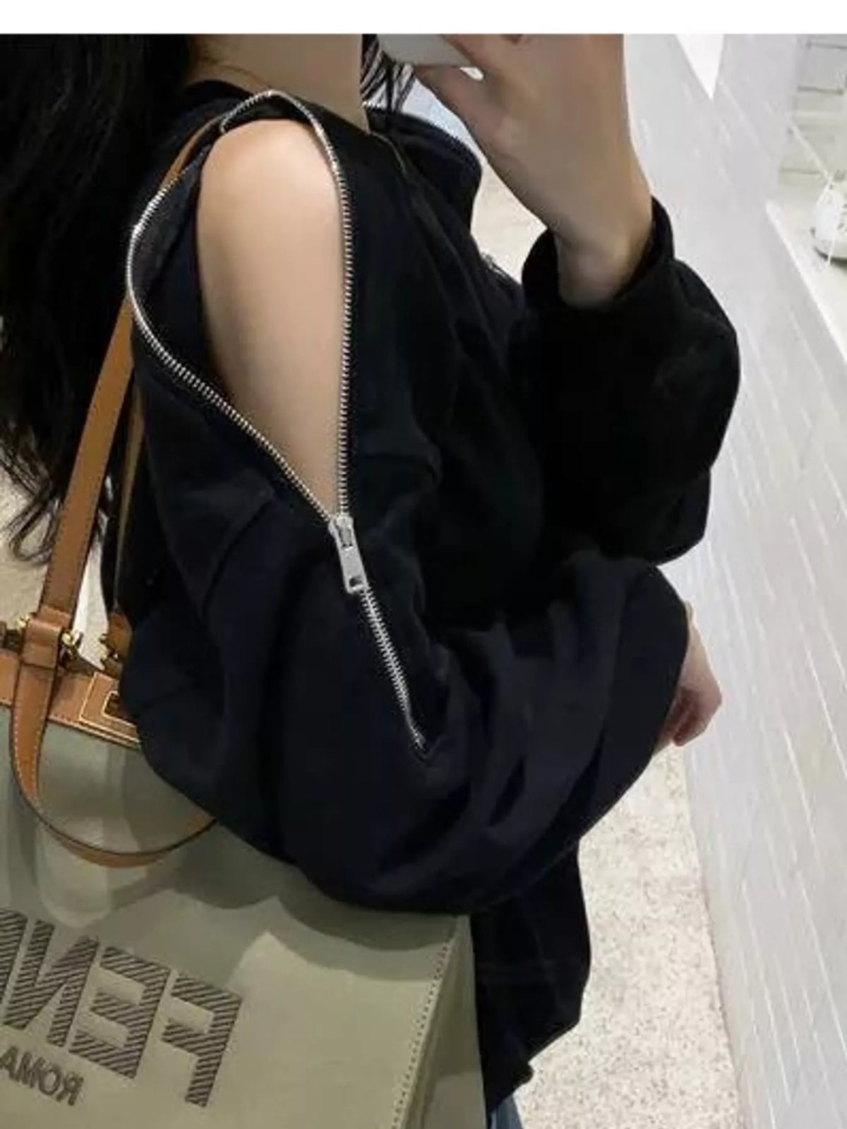 Women's Cold-Shoulder Zipper Detail Sweatshirt in black — shoulder detail view