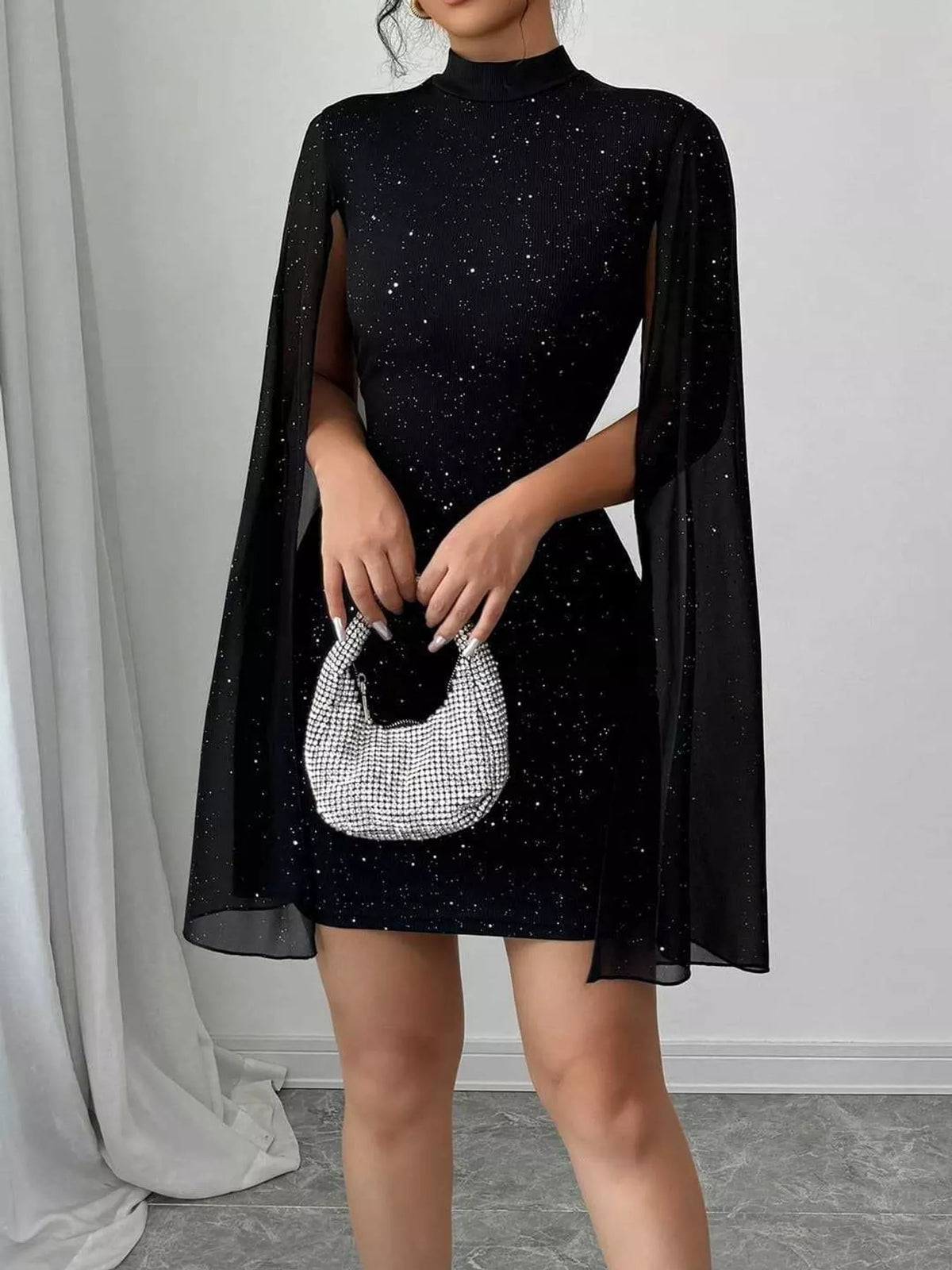 Black glitter mock neck cape-sleeve mini dress — front view