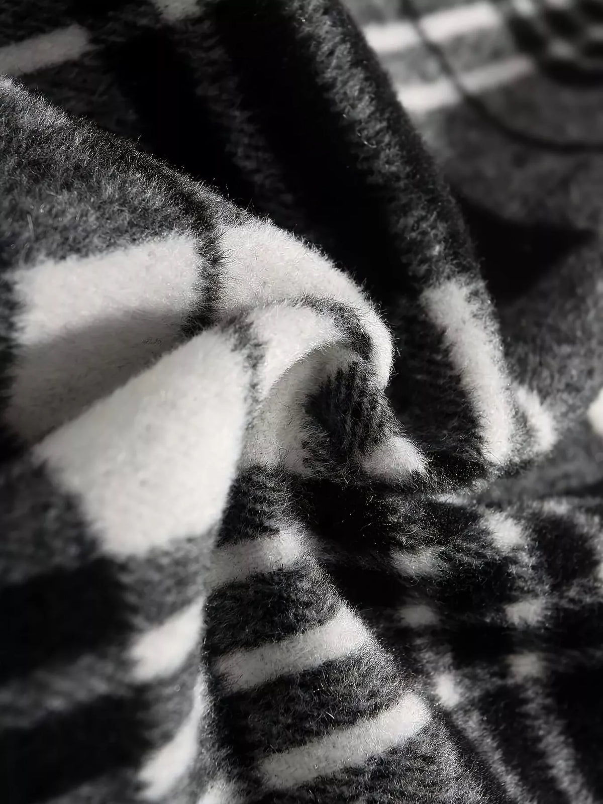 Black and white plaid A-line midi skirt, fabric close-up