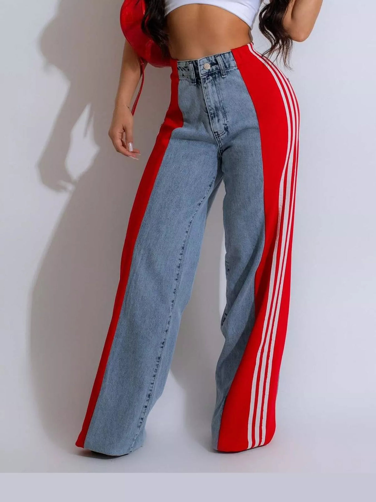 Red high-waisted wide-leg jeans with side stripe detail