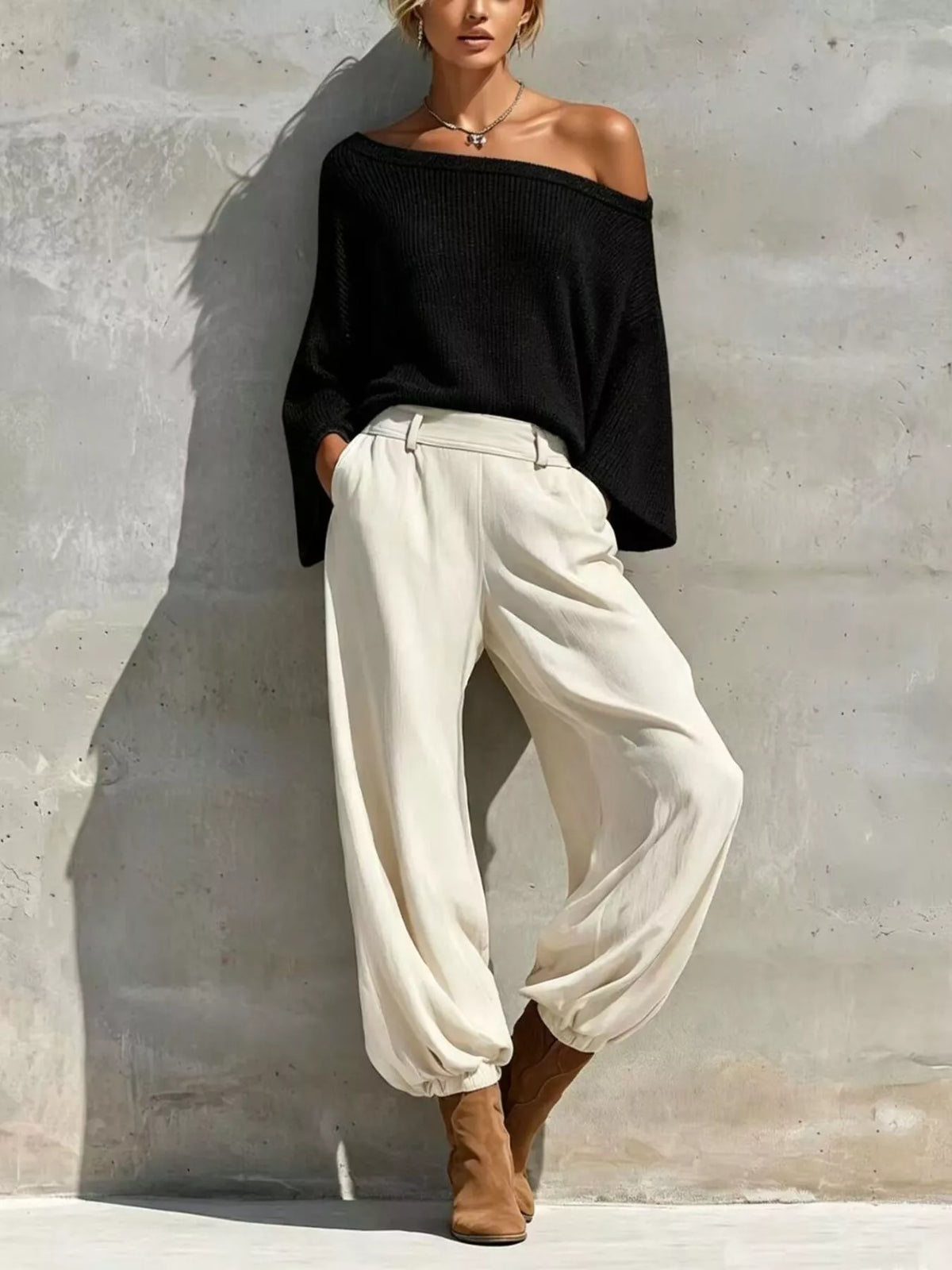 Black one-shoulder knit top and pants set, full set front view.