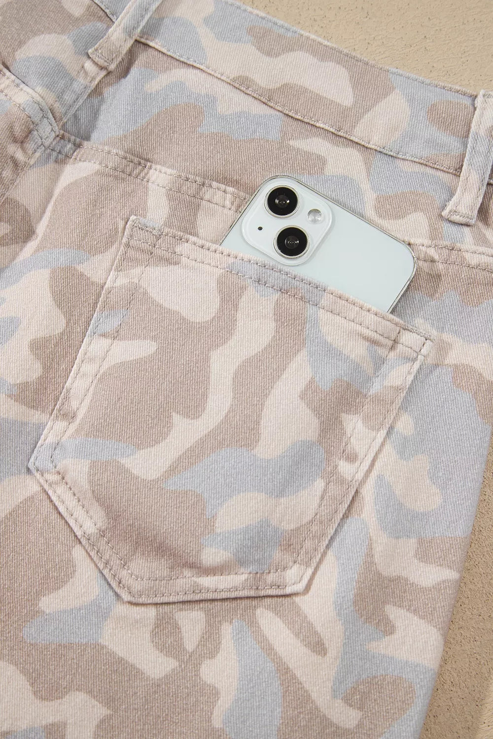 Beige camouflage barrel jeans, back pocket detail