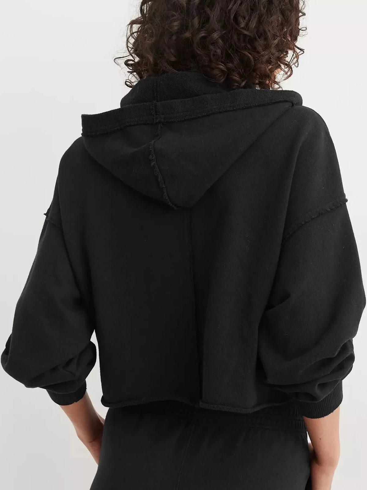 Black dropped shoulder cropped hoodie, back view