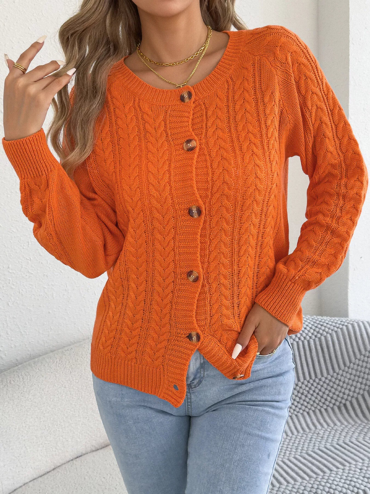 Orange cable knit button-front cardigan