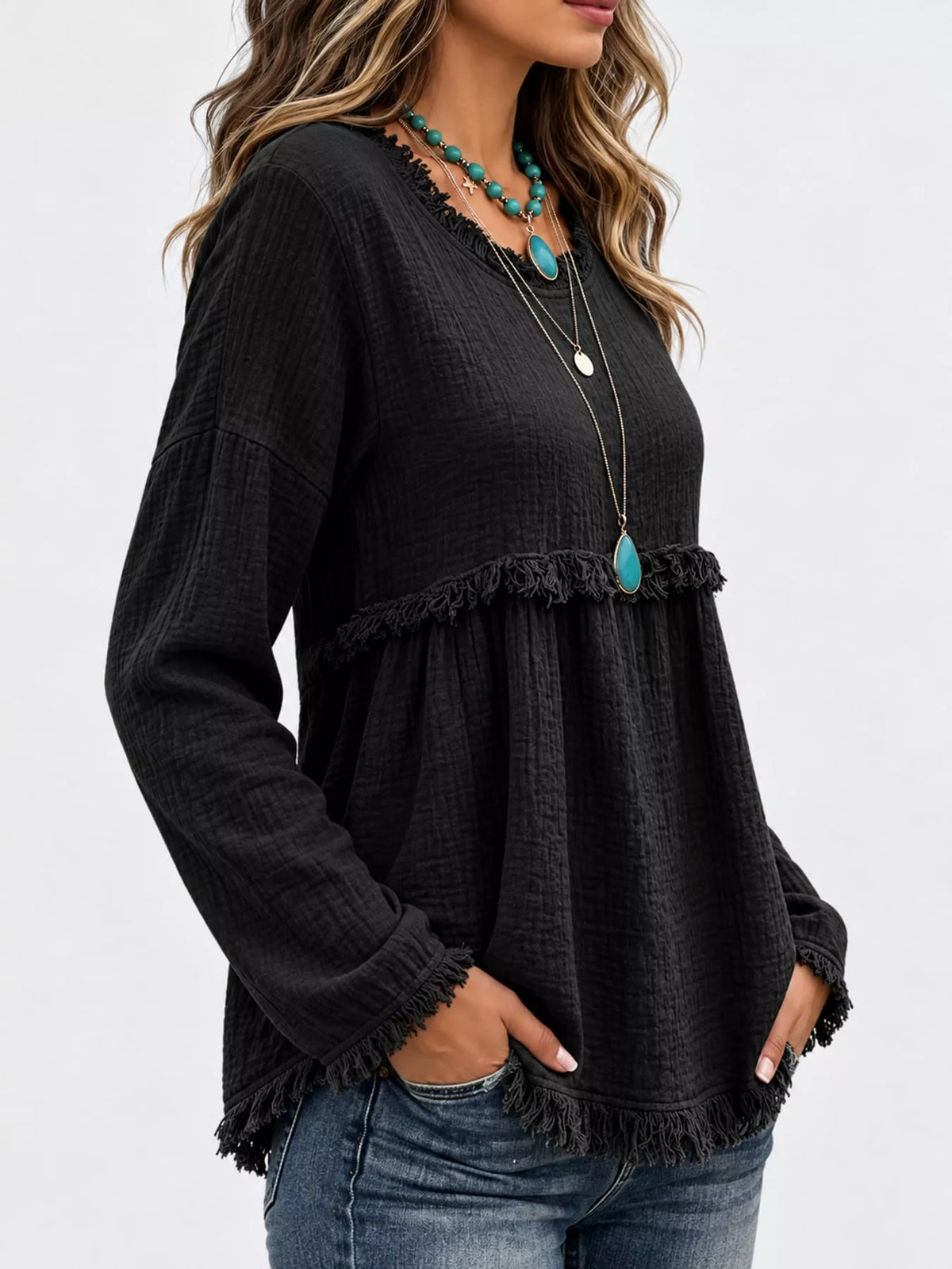 Black frayed hem textured blouse, side view