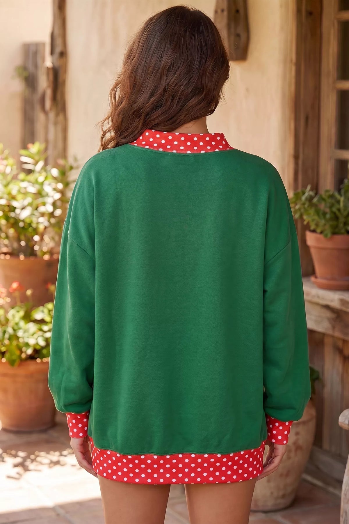 Green Merry sequin tunic sweatshirt with polka dot trim, back view