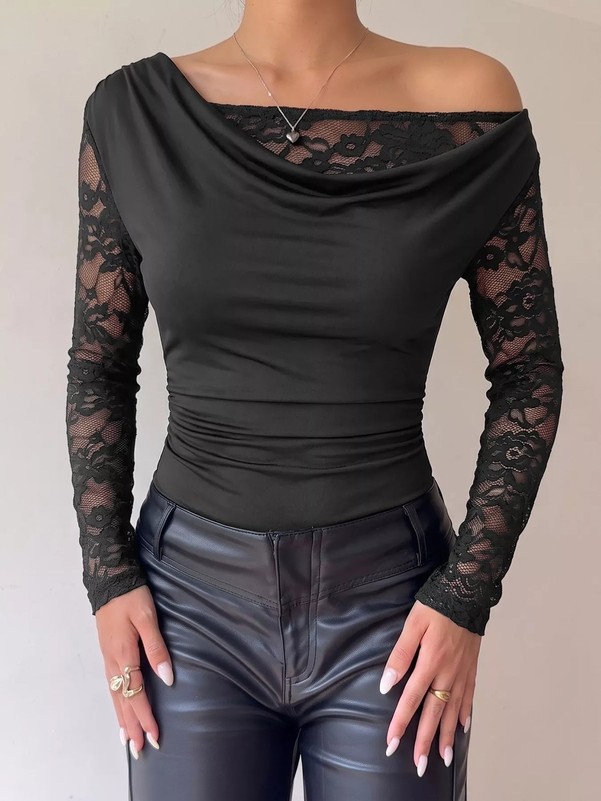 Black lace-sleeve draped bodysuit