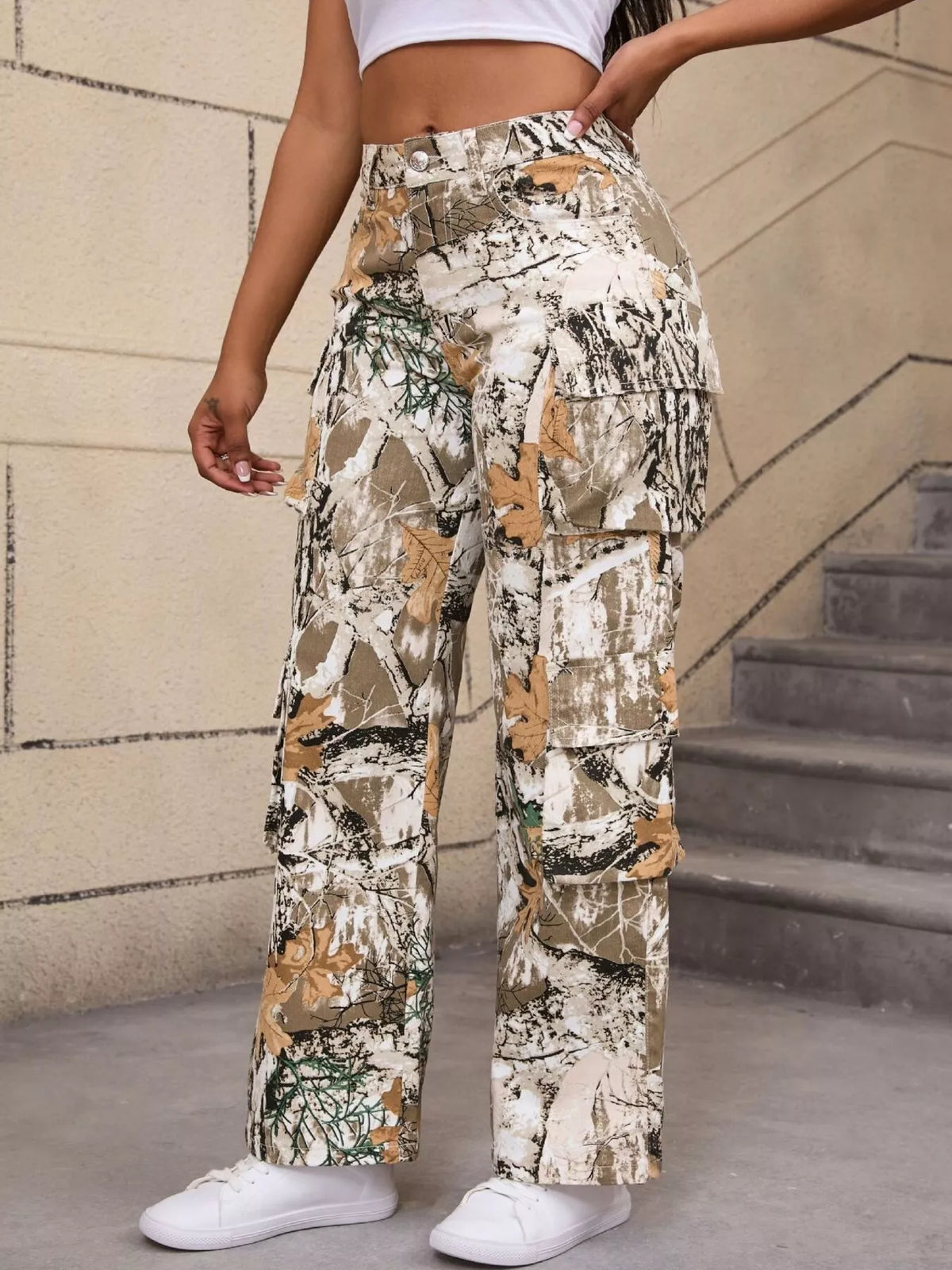 Beige and green high-waisted camouflage cargo pants, angled front view.
