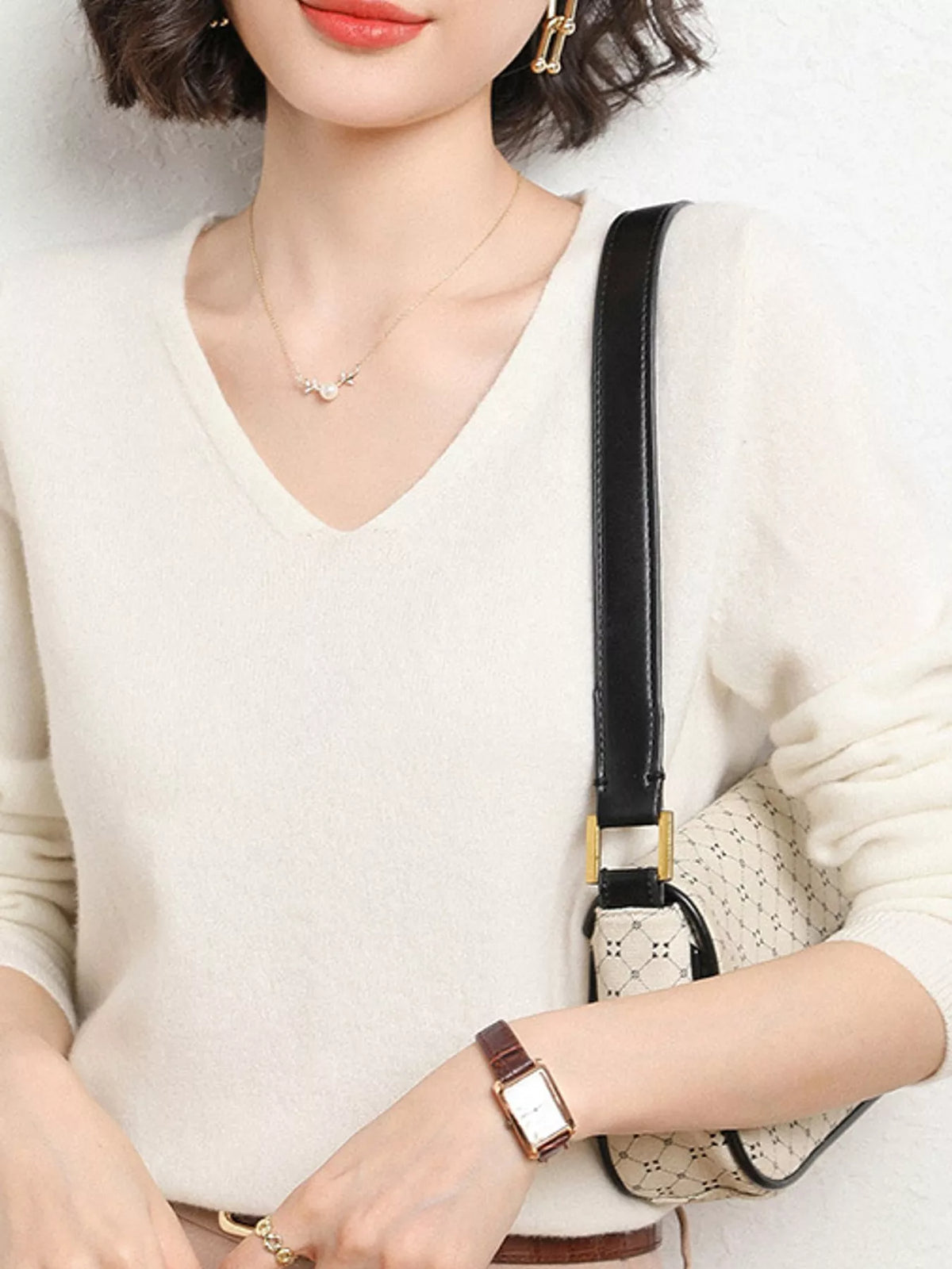 White v-neck long sleeve knit top