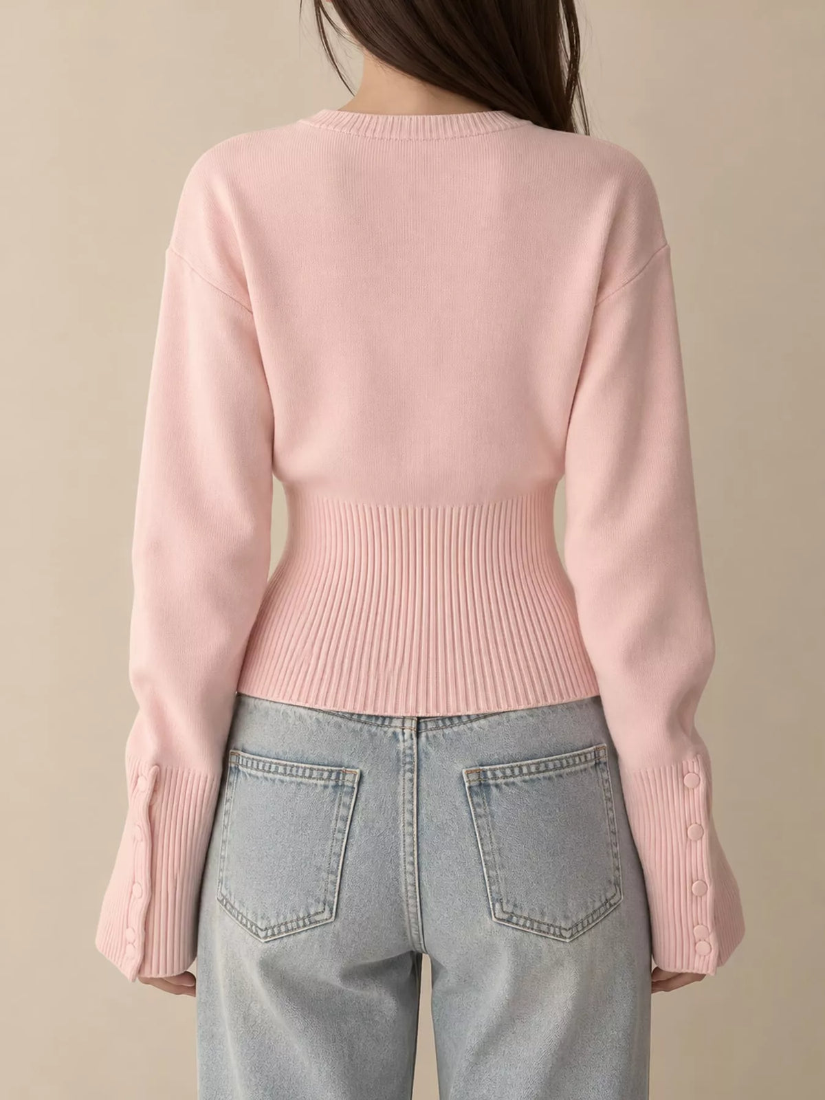 Pink button up ribbed waist cardigan, back view