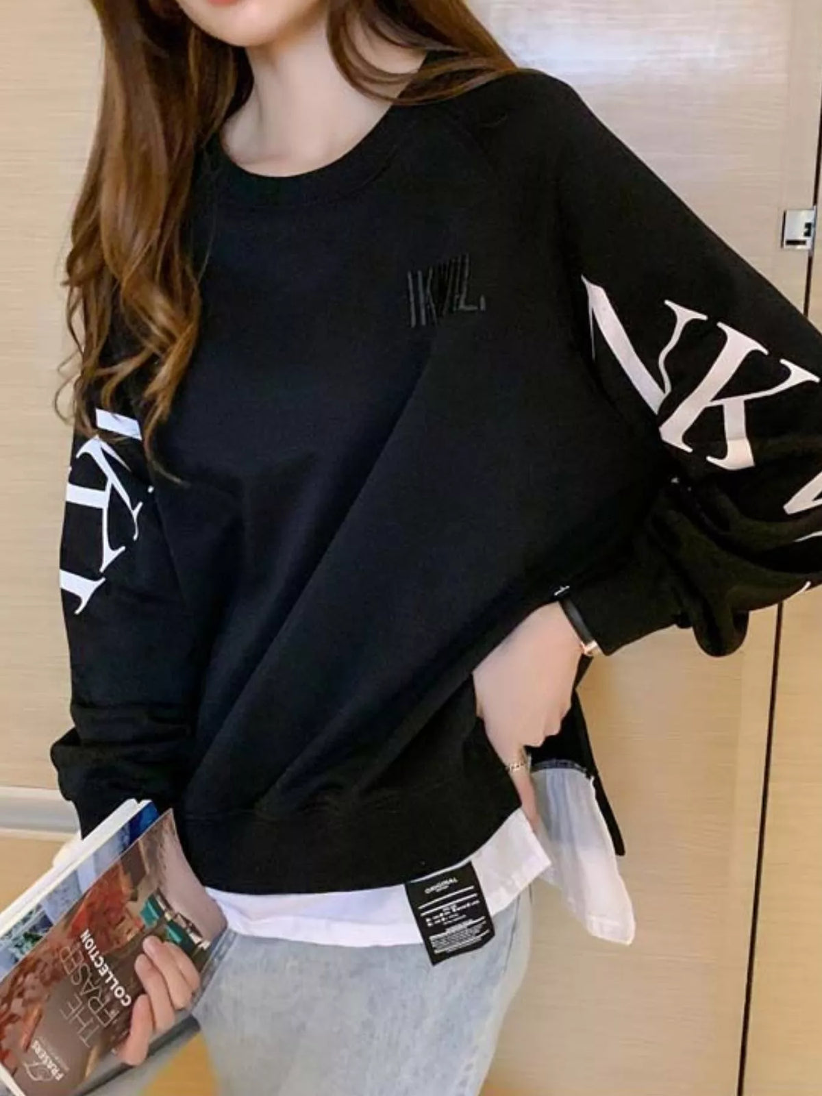 Black layered-hem sweatshirt with graphic sleeve detail