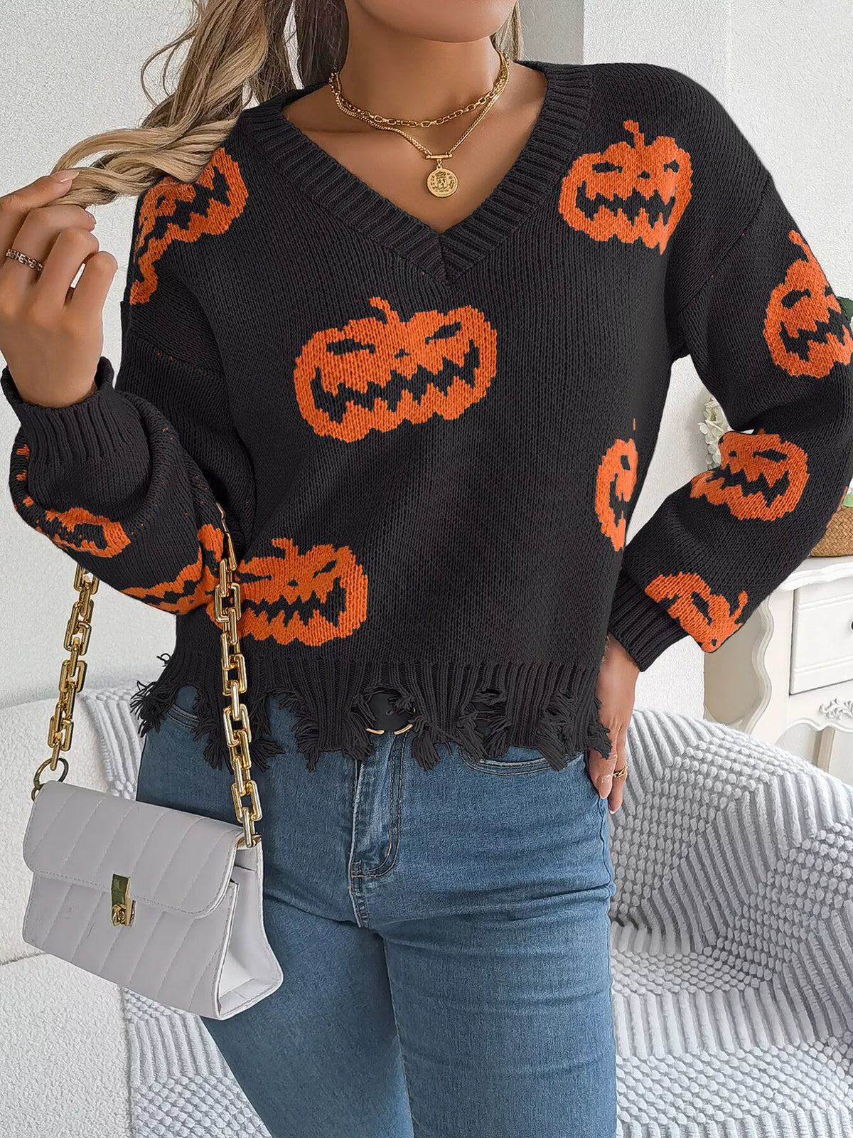 Pumpkin Distressed Hem Sweater in black, front view
