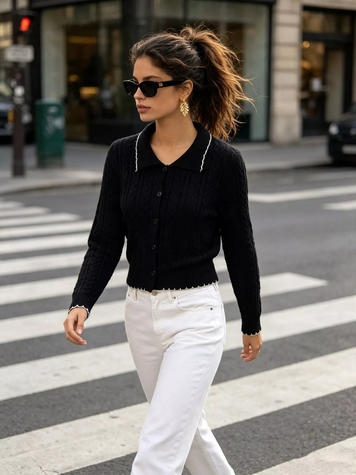 Black cable-knit polo-collar cardigan, walking front view.