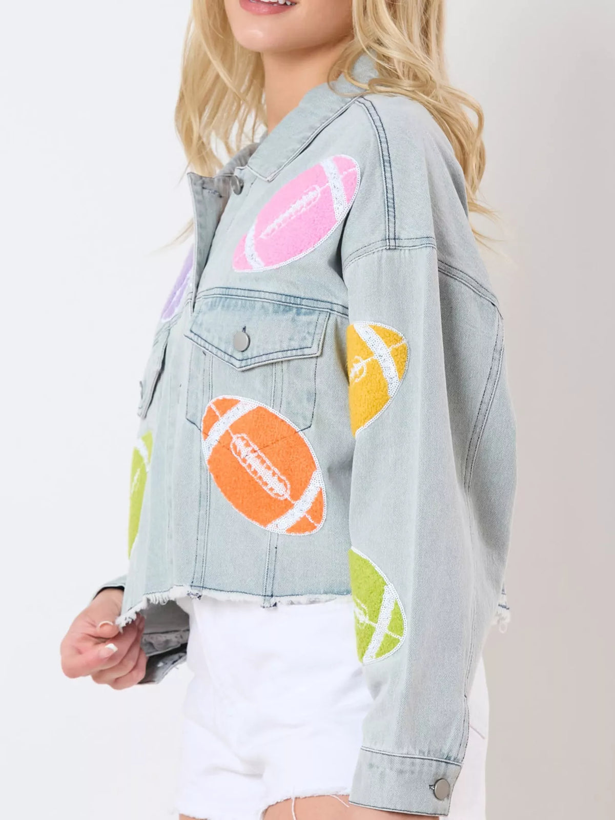 Light blue cropped denim jacket with colorful round appliques