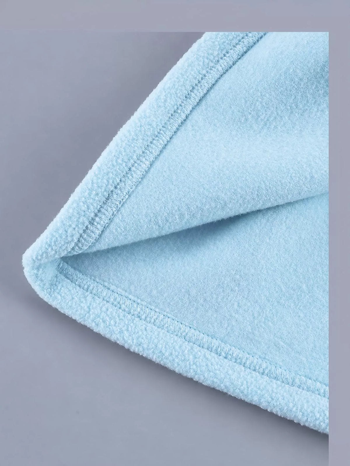 Blue drawstring fleece zip-up jacket, detail view