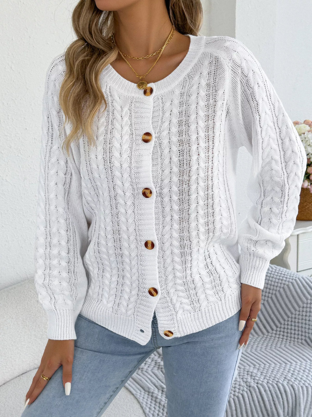 White cable knit button-front cardigan