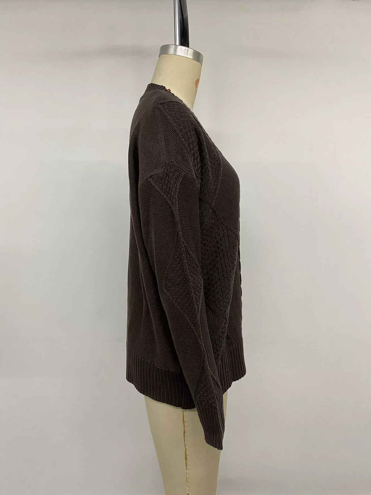 Brown V-neck cable knit cardigan, side on mannequin