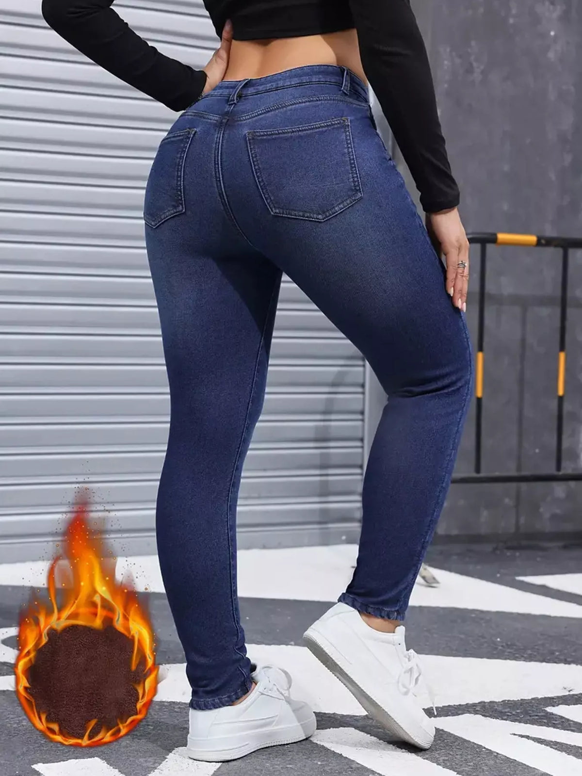 Blue high-waisted fleece-lined skinny jeans, back view