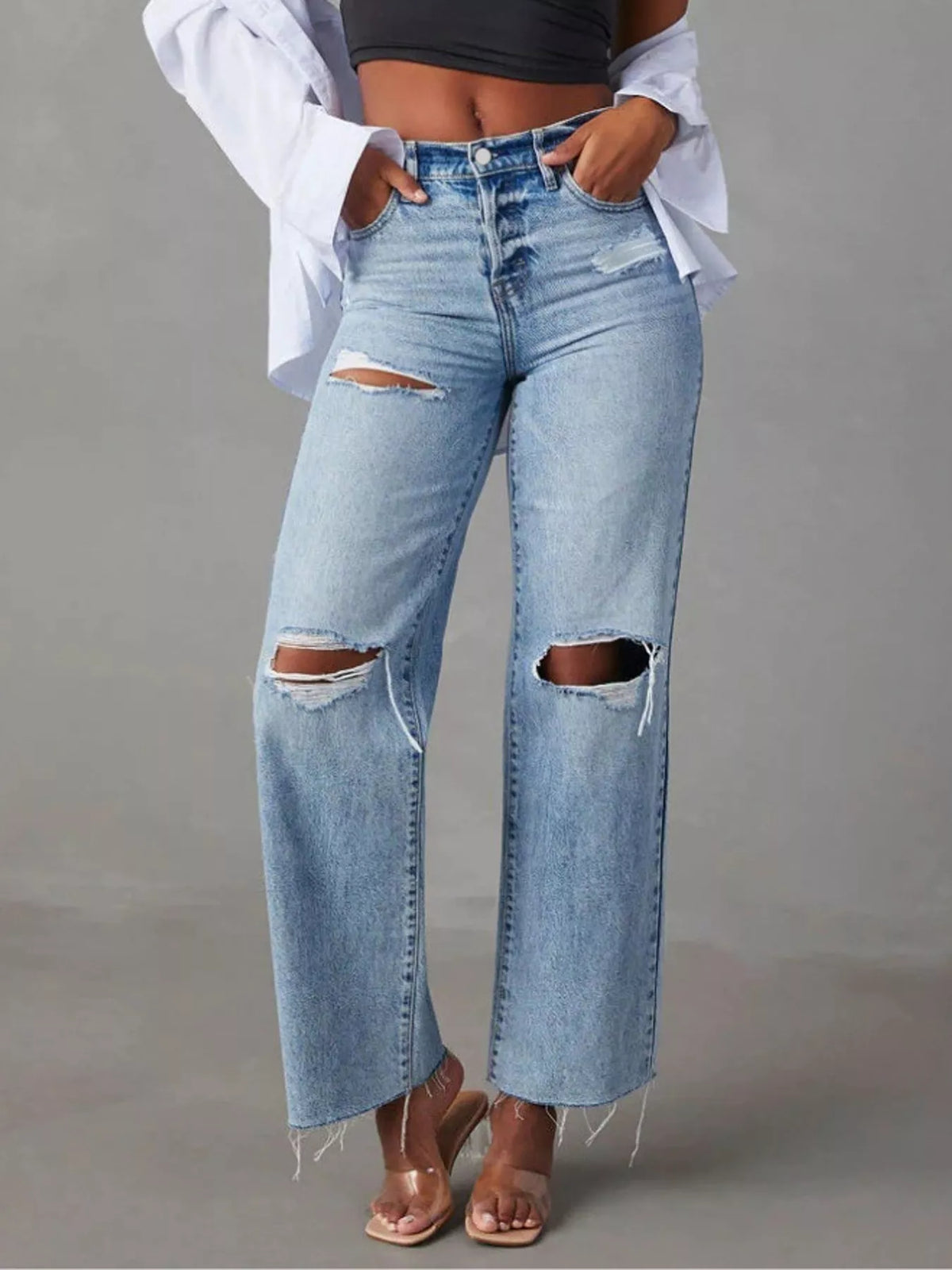 Blue high-waisted distressed jeans