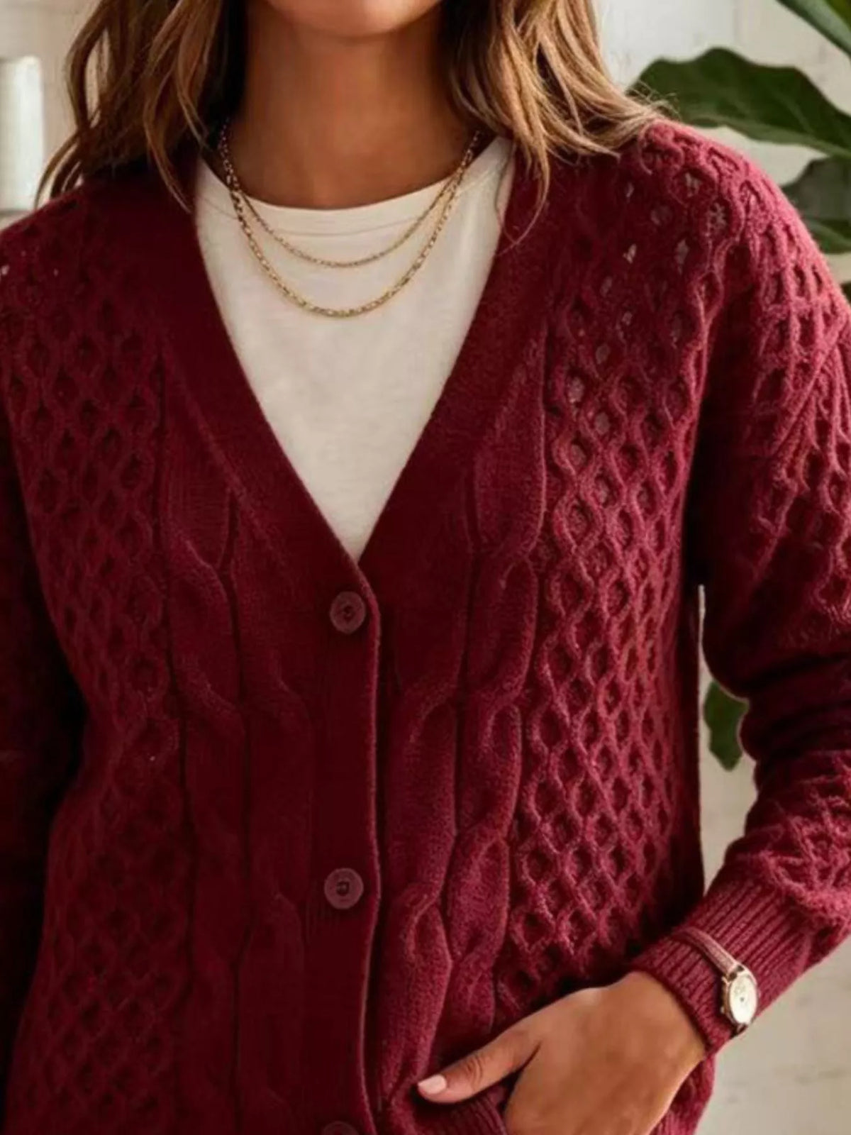 Burgundy cable-knit v-neck button-front cardigan, cable knit and button detail.