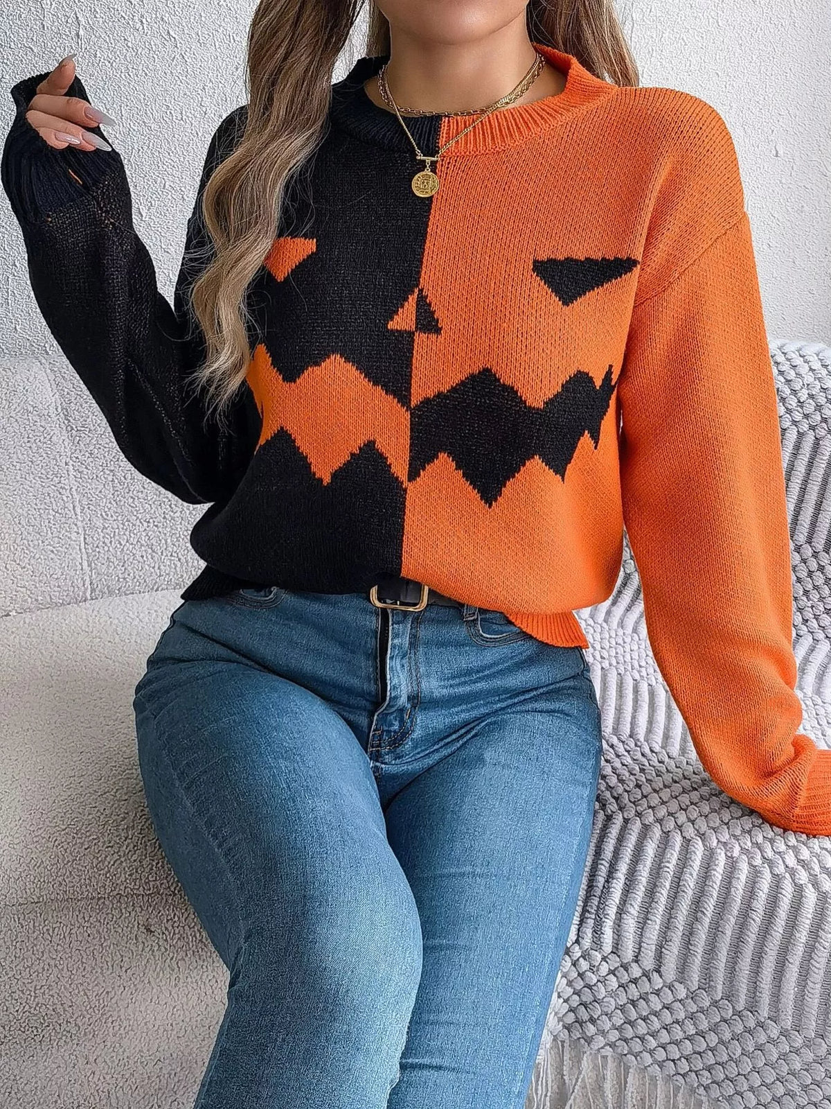 Pumpkin Face Graphic Two Tone Sweater in orange and black, front view