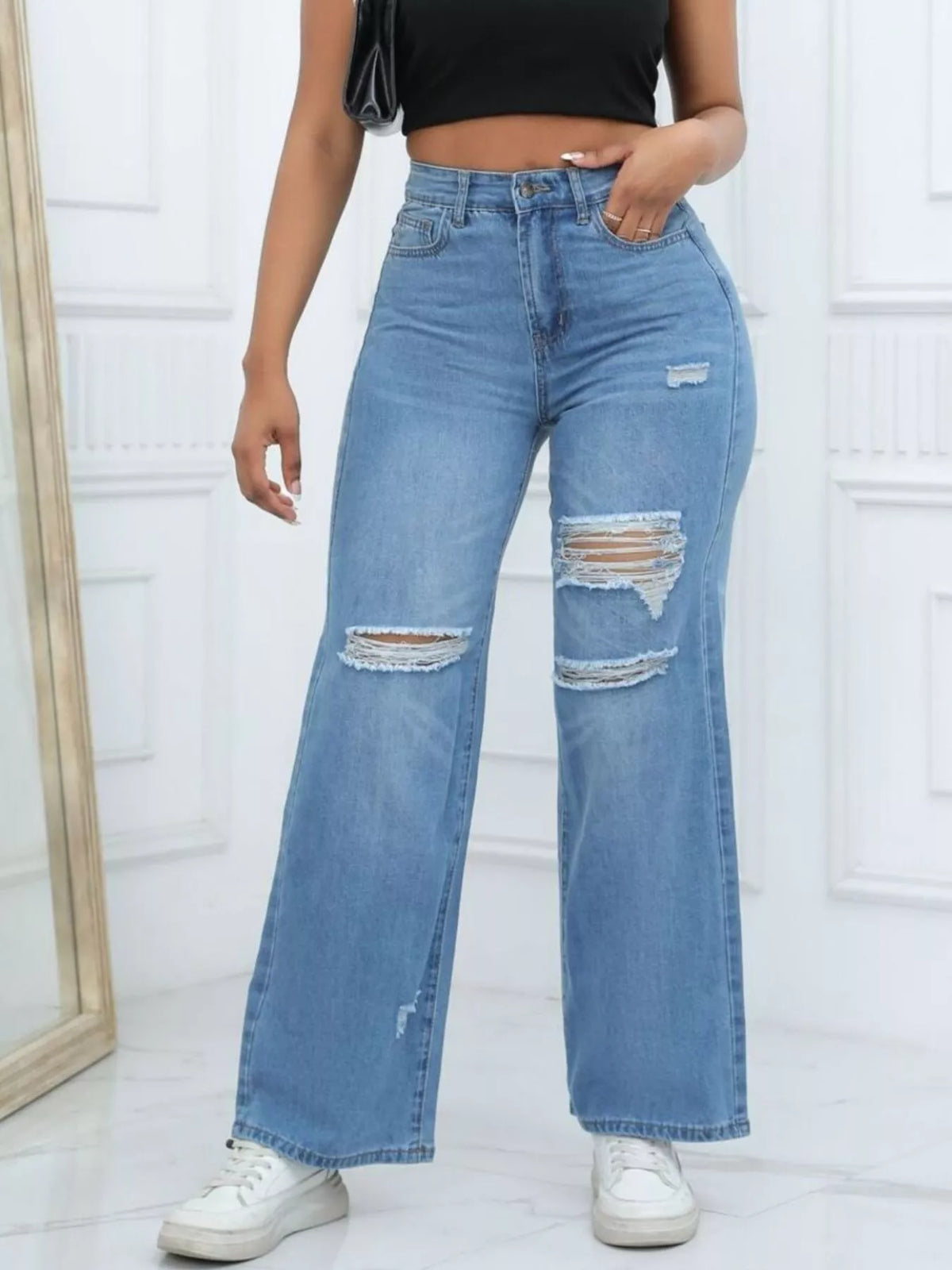 Medium blue distressed wide-leg jeans, front view