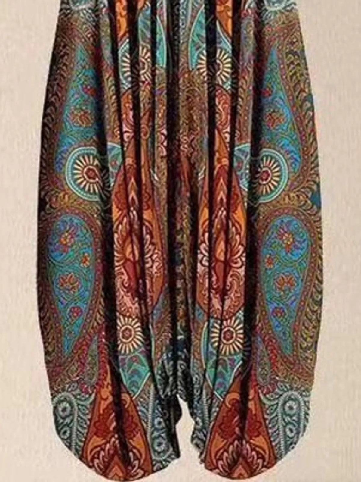 Teal and rust paisley-print V-neck sleeveless jumpsuit, leg and print detail
