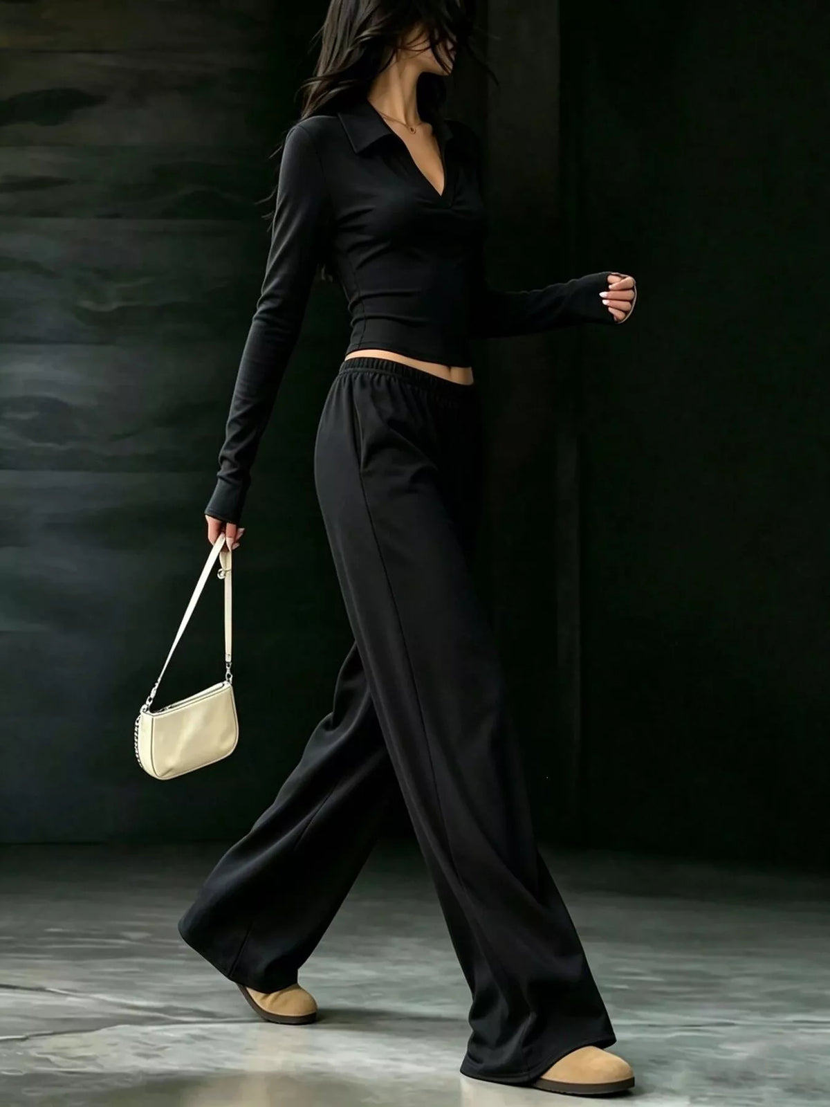 Black collared crop top and wide-leg pants set, side walking view