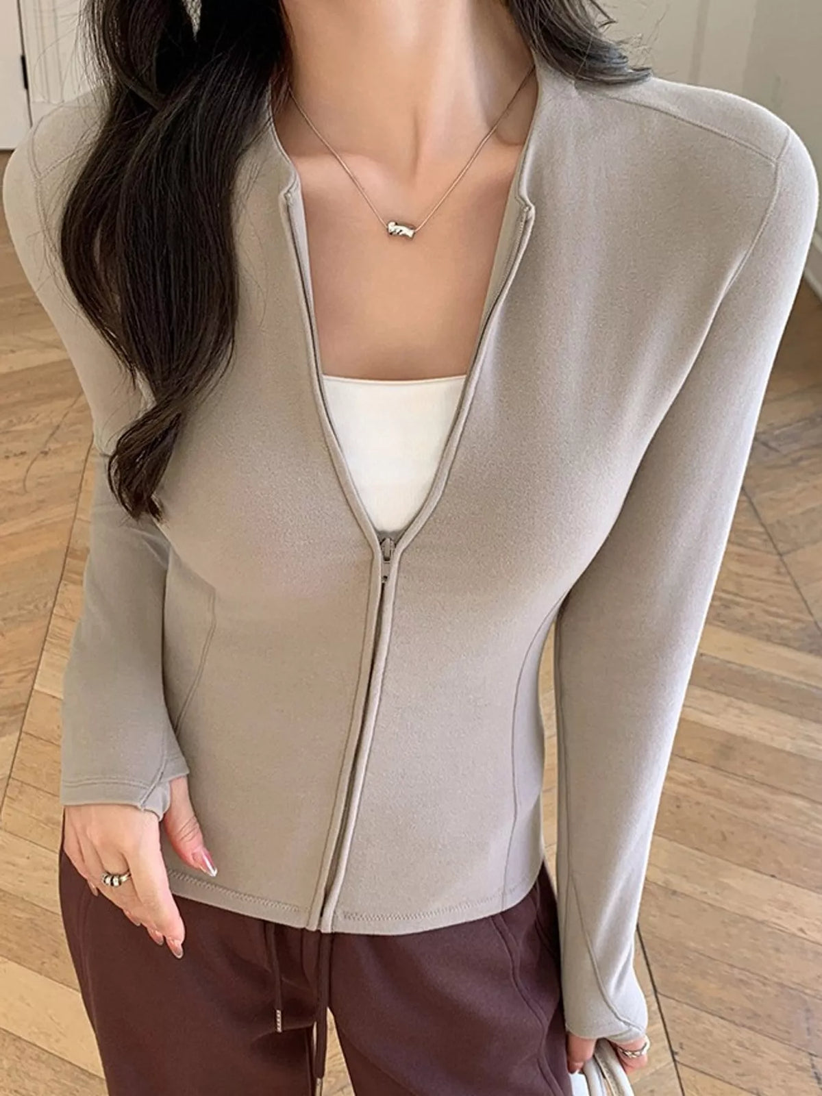 Beige slim-fit zip-up long sleeve jacket — front view