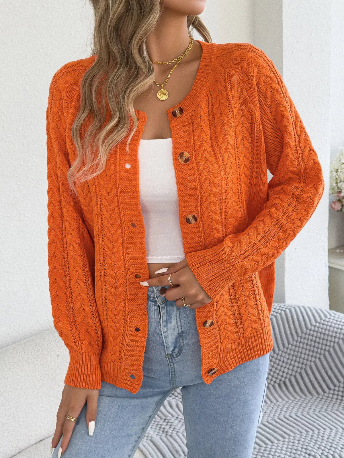Orange cable knit button-front cardigan