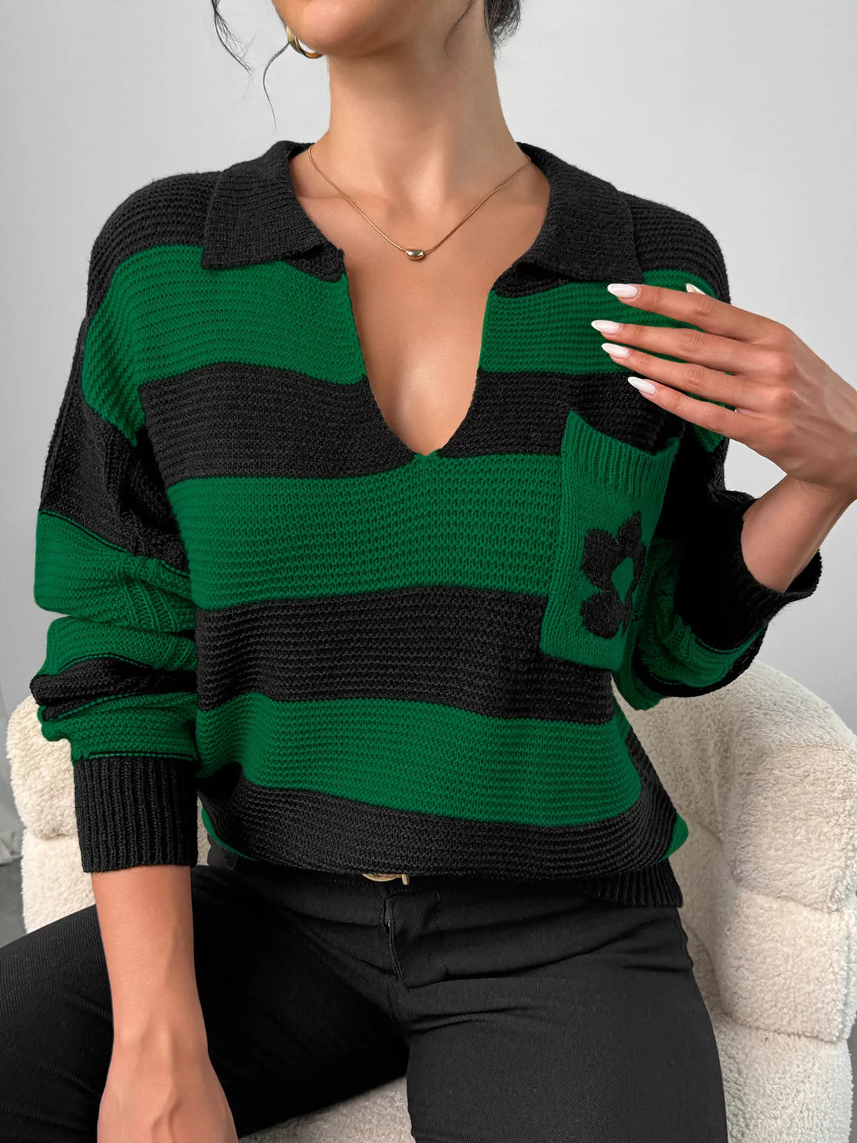 Green striped polo collar sweater with floral pocket detail, back view
