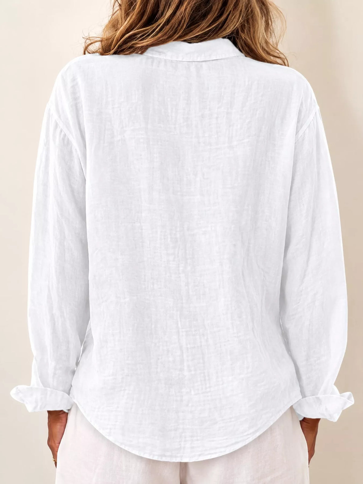 White asymmetric button-down long sleeve shirt, back view