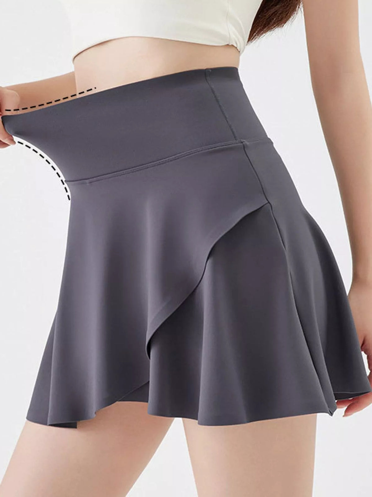 Gray flared athletic skort, waistband stretch demonstration