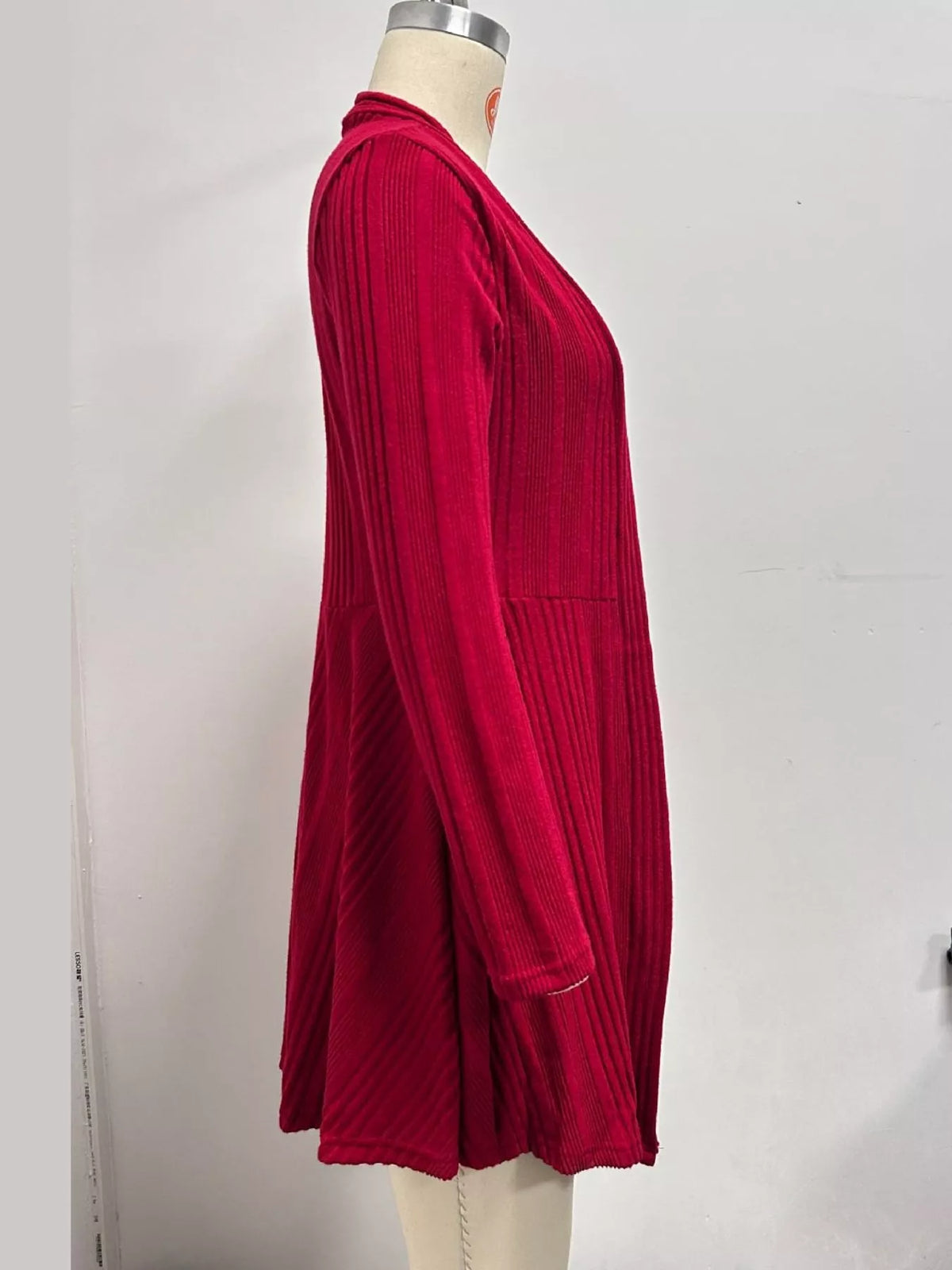 Red ribbed knit open front cardigan, back view