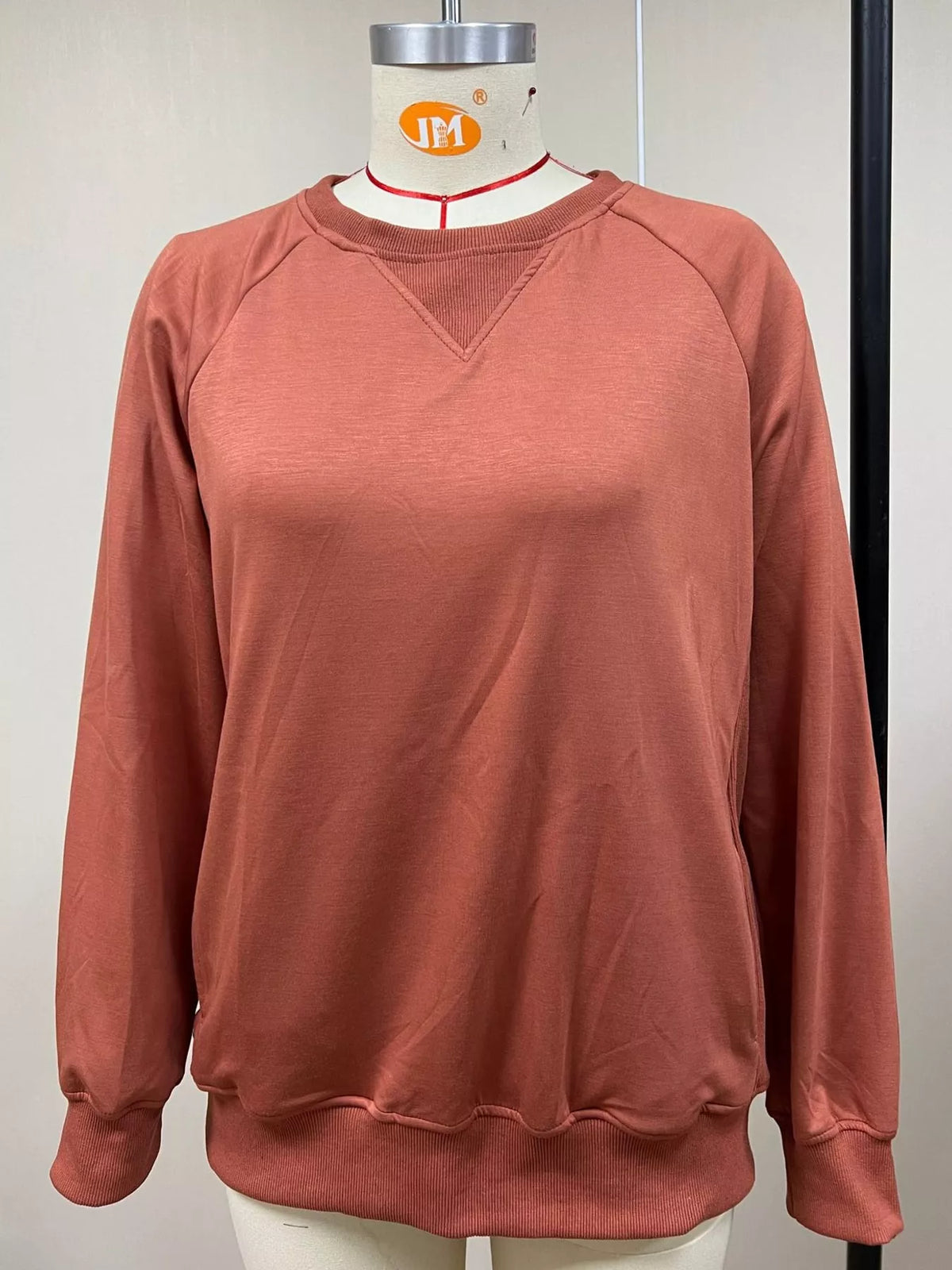 Rust crew neck raglan sleeve sweatshirt