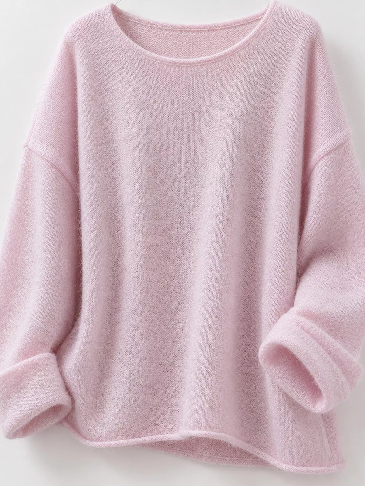 Pink round neck sweater, wide neckline, cuffs, and knit hem