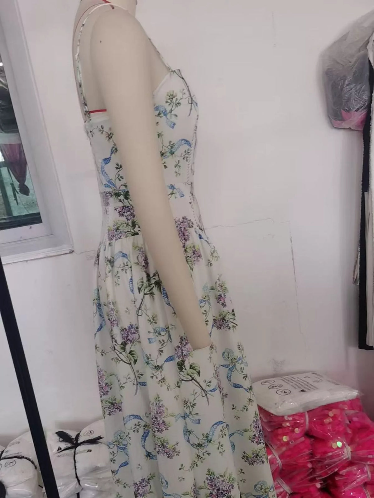Women's Paneled Bodice Gathered Midi Dress in blue floral — mannequin side view